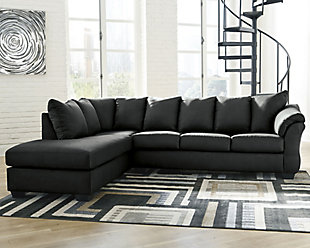 Talk about fine lines and great curves. That’s the beauty of the Darcy sectional—made to suit your appreciation for clean, contemporary style. A striking flared frame, comfy pillow top armrests and an ultra-soft upholstery that holds up to everyday living complete this fashion statement.Includes 2 pieces: left-arm facing corner chaise and right-arm facing sofa | Left-arm and "right-arm" describes the position of the arm when you face the piece | Corner-blocked frame | Attached back and loose seat cushions | High-resiliency foam cushions wrapped in thick poly fiber | Polyester upholstery | Exposed feet with faux wood finish | Estimated Assembly Time: 5 Minutes