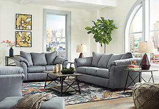 Talk about fine lines and great curves. That’s the beauty of the Darcy sofa—made to suit your appreciation for clean, contemporary style. A striking flared frame, comfy pillow top armrests and an ultra-soft upholstery that holds up to everyday living complete this fashion statement.Corner-blocked frame | Attached back and loose seat cushions | High-resiliency foam cushions wrapped in thick poly fiber | Polyester upholstery | Exposed feet with faux wood finish