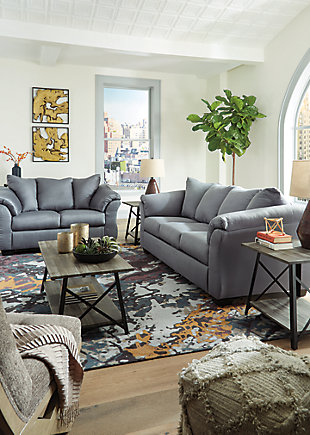 Talk about fine lines and great curves. That’s the beauty of the Darcy sofa—made to suit your appreciation for clean, contemporary style. A striking flared frame, comfy pillow top armrests and an ultra-soft upholstery that holds up to everyday living complete this fashion statement.Corner-blocked frame | Attached back and loose seat cushions | High-resiliency foam cushions wrapped in thick poly fiber | Polyester upholstery | Exposed feet with faux wood finish