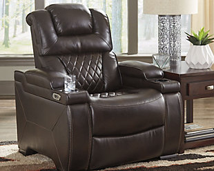 Your modern living room awaits with the Warnerton power recliner. Complete with practical faux leather beautified with diamond lattice stitching, one-touch power control, adjustable headrest and a USB charging port, it makes finding the best seat in the house a breeze. Cup holders and armrest console storage keep drinks, snacks and remotes close by. Go ahead—treat yourself to a high-design home theater experience, priced to put you at ease.One-touch power control with adjustable positions | Corner-blocked frame with metal reinforced seat | Attached cushions | High-resiliency foam cushions wrapped in thick poly fiber | Easy View™ power adjustable headrest | Each armrest with flip-top storage and cup holder | USB charging port in the power control | Polyester/polyurethane upholstery | Power cord included; UL Listed | Estimated Assembly Time: 15 Minutes