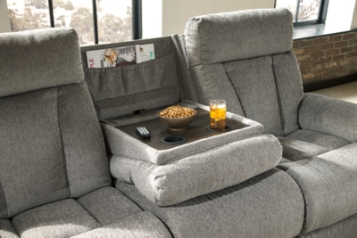 Your to-do list is complete, now it’s time for ultimate relaxation. This double reclining sofa is plush in all the right places, and will support you longer than you can binge watch your favorite TV show. The neutral upholstery is ready for a patterned throw pillow and some of your time. The middle seat’s back drops down into convenient table top with cup holders, the perfect resting spot for tablets and magazines.Dual-sided recliner; middle seat remains stationary | Drop-down center table with 2 cup holders | Pull tab reclining motion | Corner-blocked frame with metal reinforced seat | Attached back and seat cushions | High-resiliency foam cushion wrapped in thick poly fiber | Polyester upholstery