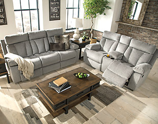 Bring your snacks and beverages and plan for a night with your feet up. This double reclining loveseat is plush in all the right places, and will support you longer than you can binge watch your favorite TV show. The neutral upholstery is ready for a patterned throw blanket and some of your time. Hide the remote in the console and claim your spot on the Mitchiner.Dual-sided recliner | Pull tab reclining motion | Corner-blocked frame with metal reinforced seat | Attached back and seat cushions | High-resiliency foam cushion wrapped in thick poly fiber | Polyester upholstery | Lift-top storage console and 2 cup holders
