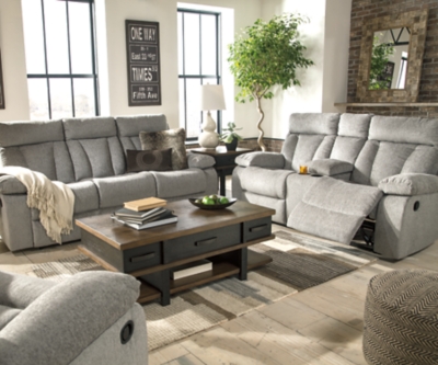 Your to-do list is complete, now it’s time for ultimate relaxation. This double reclining sofa is plush in all the right places, and will support you longer than you can binge watch your favorite TV show. The neutral upholstery is ready for a patterned throw pillow and some of your time. The middle seat’s back drops down into convenient table top with cup holders, the perfect resting spot for tablets and magazines.Dual-sided recliner; middle seat remains stationary | Drop-down center table with 2 cup holders | Pull tab reclining motion | Corner-blocked frame with metal reinforced seat | Attached back and seat cushions | High-resiliency foam cushion wrapped in thick poly fiber | Polyester upholstery