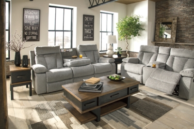 Your to-do list is complete, now it’s time for ultimate relaxation. This double reclining sofa is plush in all the right places, and will support you longer than you can binge watch your favorite TV show. The neutral upholstery is ready for a patterned throw pillow and some of your time. The middle seat’s back drops down into convenient table top with cup holders, the perfect resting spot for tablets and magazines.Dual-sided recliner; middle seat remains stationary | Drop-down center table with 2 cup holders | Pull tab reclining motion | Corner-blocked frame with metal reinforced seat | Attached back and seat cushions | High-resiliency foam cushion wrapped in thick poly fiber | Polyester upholstery