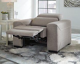 The challenge: design a cutting-edge power recliner you’d never guess was a recliner. Super sleek and streamlined, the Mabton power recliner in a taupe gray padded velvet might just be our best-kept secret. Rest assured, you’d be hard-pressed to find a modern recliner that looks so high end yet is so comfortably priced. Integrated elements include an Easy View™ adjustable headrest for low-profile style when it’s down and a high level of comfort when you’re kicking back and reclining. Factor in a one-touch power control (with a USB port) placed on the inside track arm, and you have the makings for one beautifully deceptive piece of furniture.One-touch power control with adjustable positions, Easy View™ adjustable headrest and USB plug-in | Corner-blocked frame | Attached cushions | High-resiliency foam cushions wrapped in thick poly fiber | Polyester upholstery | Power cord included; UL Listed | Exposed black feet | Estimated Assembly Time: 15 Minutes