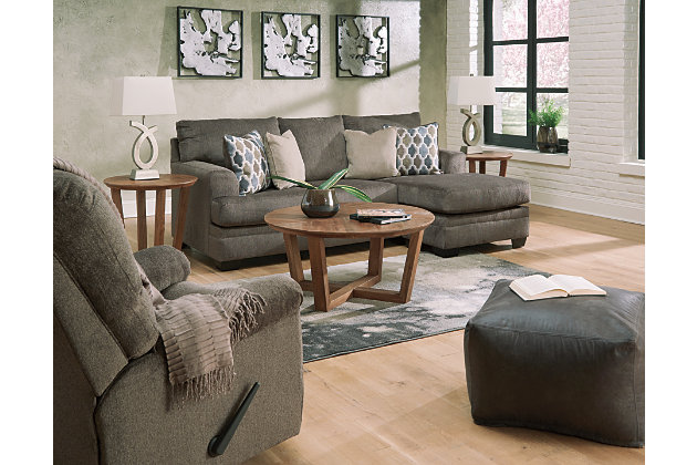The Dorsten contemporary sofa chaise and rocker recliner set has comfort written all over it. From the plush cushions to the textured gray fabric, it’s a total winner for relaxation. This sofa chaise has the corner on ultra-contemporary style made for easy, everyday living while the rocker recliner invites you to kick back and relax.Includes sofa chaise and rocker recliner | Corner-blocked frame | Sofa chaise with attached back and loose seat cushions | Rocker recliner with attached cushions | Rocker recliner with one-pull reclining motion | Rocker recliner with gentle rocking motion | High-resiliency foam cushions wrapped in thick poly fiber | Polyester upholstery | Sofa chaise toss pillows included | Pillows with soft polyfill | Exposed feet with faux wood finish | Chaise can be positioned on either side (thanks to reversible seat cushion) | Sofa chaise with platform foundation system resists sagging 3x better than spring system after 20,000 testing cycles by providing more even support