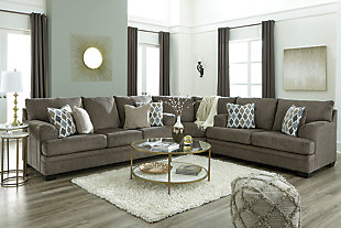 The contemporary Dorsten sofa has comfort written all over it. From the plush cushions to the textured gray fabric, it’s a total winner for relaxation. Designer throw pillows in blue, brown and tan complement the richly neutral upholstery.Corner-blocked frame | Attached back and loose seat cushions | High-resiliency foam cushions wrapped in thick poly fiber | 4 decorative pillows included | Pillows with soft polyfill | Polyester upholstery and pillows | Exposed feet with faux wood finish | Platform foundation system resists sagging 3x better than spring system after 20,000 testing cycles by providing more even support | Smooth platform foundation maintains tight, wrinkle-free look without dips or sags that can occur over time with sinuous spring foundations