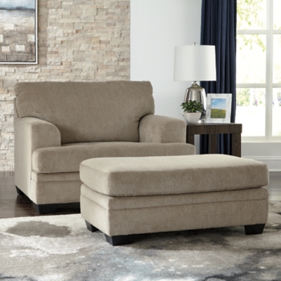 The contemporary Dorsten oversized chair has comfort written all over it. From the wide, plush seat to the textured fabric, it’s a total winner for relaxation. Just grab a throw blanket and cozy up to its warmth.Corner-blocked frame | High-resiliency foam cushions wrapped in thick poly fiber | Polyester upholstery | Exposed feet with faux wood finish | Platform foundation system resists sagging 3x better than spring system after 20,000 testing cycles by providing more even support | Smooth platform foundation maintains tight, wrinkle-free look without dips or sags that can occur over time with sinuous spring foundations