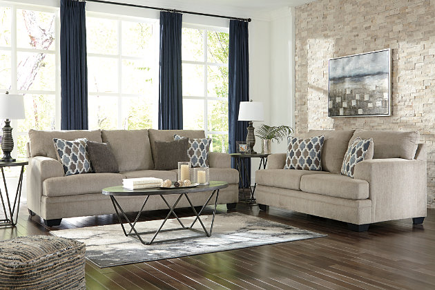 The Dorsten contemporary sofa and loveseat set has comfort written all over it. From the plush cushions to the textured tan fabric, it’s a total winner for relaxation. Designer throw pillows in blue, brown and tan complement the neutral upholstery.Includes sofa and loveseat | Corner-blocked frame | Attached back and loose seat cushions | High-resiliency foam cushions wrapped in thick poly fiber | Toss pillows included | Pillows with soft polyfill | Polyester upholstery and pillows | Exposed feet with faux wood finish | Sofa and loveseat with platform foundation system resists sagging 3x better than spring system after 20,000 testing cycles by providing more even support | Smooth platform foundation maintains tight, wrinkle-free look without dips or sags that can occur over time with sinuous spring foundations