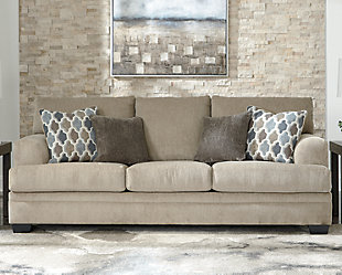The contemporary Dorsten sofa has comfort written all over it. From the plush cushions to the textured tan fabric, it’s a total winner for relaxation. Designer throw pillows in blue, brown and tan complement the richly neutral upholstery.Corner-blocked frame | Attached back and loose seat cushions | High-resiliency foam cushions wrapped in thick poly fiber | 4 decorative pillows included | Pillows with soft polyfill | Polyester upholstery and pillows | Exposed feet with faux wood finish | Platform foundation system resists sagging 3x better than spring system after 20,000 testing cycles by providing more even support | Smooth platform foundation maintains tight, wrinkle-free look without dips or sags that can occur over time with sinuous spring foundations