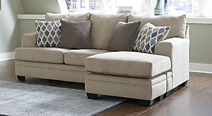The Dorsten sofa chaise has the corner on ultra-contemporary style made for easy, everyday living. Upholstered in a plush tan chenille, it takes neutral sophistication to another level. And talk about accommodating. Thanks to a versatile chaise with movable ottoman and reversible seat cushions, you can enjoy the chaise on either side to suit your space.Corner-blocked frame | Attached back and loose seat cushions | High-resiliency foam cushions wrapped in thick poly fiber | Polyester upholstery | Throw pillows included | Pillows with soft polyfill | Exposed feet with faux wood finish | Chaise can be positioned on either side (thanks to reversible seat cushion and movable ottoman) | Platform foundation system resists sagging 3x better than spring system after 20,000 testing cycles by providing more even support | Smooth platform foundation maintains tight, wrinkle-free look without dips or sags that can occur over time with sinuous spring foundations