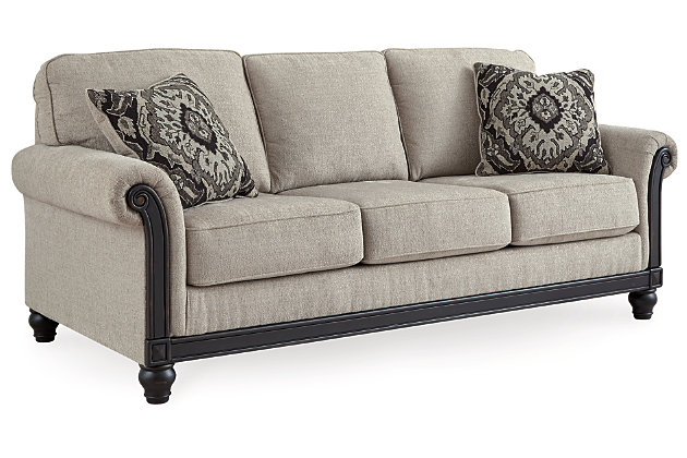 If you’re one to embrace new traditions, behold the beauty of the Benbrook sofa. Giving stately elegance a sense of newfound flair, it's dressed to impress with a distressed black exposed rail that complements today’s more relaxed lifestyles. Tailored elements like a light and lovely linen-weave upholstery, romantic roll arms and turned bun feet make this updated classic complete.Corner-blocked frame | Attached back and loose cushions | High-resiliency foam cushions wrapped in thick poly fiber | Polyester upholstery | Throw pillows included | Pillows with soft polyfill | Exposed rail and feet with faux wood finish | Platform foundation system resists sagging 3x better than spring system after 20,000 testing cycles by providing more even support | Smooth platform foundation maintains tight, wrinkle-free look without dips or sags that can occur over time with sinuous spring foundations