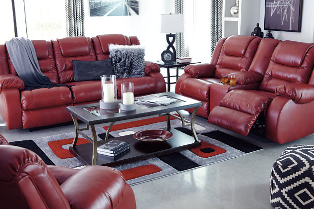The Vacherie reclining sofa puts comfort in style. Plush cushions are stitched to perfection. Ease back into the deep seating to rest your head on the supportive headrest. Supple fabric gives your room the high end look of leather with a spicy pop of color. You’ll love how easy it is to recline in infinite positions of relaxation.Dual-sided recliner; middle seat remains stationary | Pull tab reclining motion | Corner-blocked frame with metal reinforced seats | Attached back and seat cushions | High-resiliency foam cushions wrapped in thick poly fiber | Vinyl/polyester/polyurethane upholstery