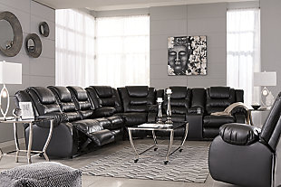 When it comes to comfort, style and value, the Vacherie faux leather rocker recliner in black rocks. Tailored for feel-good flair, its fashion-forward bustle back design is enhanced with sculpted padding on the headrest for cradling support. Channel cushioning along the sides flows into thick, wrapped pillowtop armrests that are truly over the top. And while it might look like you broke the bank, a sumptuously soft leather-like fabric keeps indulgence well within budget.Gentle roc motion | Pull tab reclining motion | Corner-blocked frame with metal reinforced seat | Attached back and seat cushions | High-resiliency foam cushions wrapped in thick poly fiber | Vinyl/polyester/polyurethane upholstery