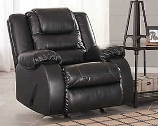 When it comes to comfort, style and value, the Vacherie faux leather rocker recliner in black rocks. Tailored for feel-good flair, its fashion-forward bustle back design is enhanced with sculpted padding on the headrest for cradling support. Channel cushioning along the sides flows into thick, wrapped pillowtop armrests that are truly over the top. And while it might look like you broke the bank, a sumptuously soft leather-like fabric keeps indulgence well within budget.Gentle roc motion | Pull tab reclining motion | Corner-blocked frame with metal reinforced seat | Attached back and seat cushions | High-resiliency foam cushions wrapped in thick poly fiber | Vinyl/polyester/polyurethane upholstery