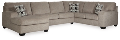 A mastery in less is more, the Ballinasloe sectional manages to make cool, contemporary design so warm and cozy. A new twist on neutral, the sectional’s soothing “platinum” tone upholstery is incredibly plush to the touch. Gently rounded corners give the clean-lined profile a sense of ease, for a high-style look that’s ultra inviting.Includes 3 pieces: left-arm facing corner chaise, armless loveseat and right-arm facing sofa | "Left-arm" and "right-arm" describe the position of the arm when you face the piece | Corner-blocked frame | Attached back and loose seat cushions | High-resiliency foam cushions wrapped in thick poly fiber | 3 toss pillows included | Pillows with soft polyfill | Polyester upholstery and pillows | Exposed feet with faux wood finish | Estimated Assembly Time: 10 Minutes