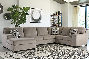 A mastery in less is more, the Ballinasloe sectional manages to make cool, contemporary design so warm and cozy. A new twist on neutral, the sectional’s soothing “platinum” tone upholstery is incredibly plush to the touch. Gently rounded corners give the clean-lined profile a sense of ease, for a high-style look that’s ultra inviting.Includes 3 pieces: left-arm facing corner chaise, armless loveseat and right-arm facing sofa | "Left-arm" and "right-arm" describe the position of the arm when you face the piece | Corner-blocked frame | Attached back and loose seat cushions | High-resiliency foam cushions wrapped in thick poly fiber | 3 toss pillows included | Pillows with soft polyfill | Polyester upholstery and pillows | Exposed feet with faux wood finish | Estimated Assembly Time: 10 Minutes
