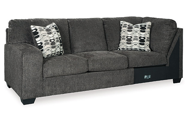 A mastery in less is more, the Ballinasloe sectional with ottoman manages to make cool, contemporary design so warm and cozy. A new twist on neutral, the sectional’s soothing “smoky” gray upholstery is incredibly plush to the touch. Gently rounded corners give the clean-lined profile a sense of ease, for a high-style look that’s ultra inviting. Rest assured, an oversized ottoman gives everyone plenty of room to kick up their heels, or use with a tray for easy entertaining.Includes 3-piece sectional (right-arm facing corner chaise, armless loveseat and left-arm facing sofa) and an oversized ottoman | Left-arm and "right-arm" describe the position of the arm when you face the piece | Corner-blocked frame | Attached back and loose seat cushions | Firmly cushioned ottoman | High-resiliency foam cushions wrapped in thick poly fiber | Accent pillows included | Pillows with soft polyfill | Polyester upholstery and pillows | Exposed feet with faux wood finish | Estimated Assembly Time: 10 Minutes