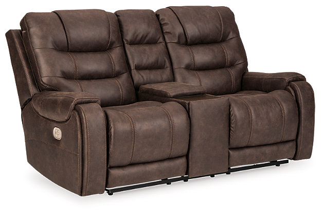 Discover just how much better faux leather can be in the richly styled Yacolt power reclining loveseat. Outfitted with our latest and greatest padded faux leather with an authentic weathered effect, this ultra-comfortable reclining loveseat with power is the embodiment of everyday luxury. Sporting a 43" high-back design, built-out headrest for added support and extended ottoman, it truly has you covered from head to toe. An Easy View™ power adjustable headrest lets you fully recline and still have a primo view of the TV. Plus, you can chill out while you recharge thanks to a USB charging port in the one-touch power control. And how about a storage console with hidden cup holders and built-in wood-tone tabletop? We’ll drink to that.Dual-sided recliner | One-touch power control with Easy View™ power adjustable headrest and USB plug-in | Corner-blocked frame with metal reinforced seat | Attached cushions | 43" high back | Storage console with 2 hidden stainless steel cup holders and built-in wood-tone tabletop | Cup holders removable for easy cleaning | High-resiliency foam cushions wrapped in thick poly fiber | Polyester/polyurethane (faux leather) upholstery | Extended ottoman for enhanced comfort | Power cord included; UL Listed | Estimated Assembly Time: 15 Minutes
