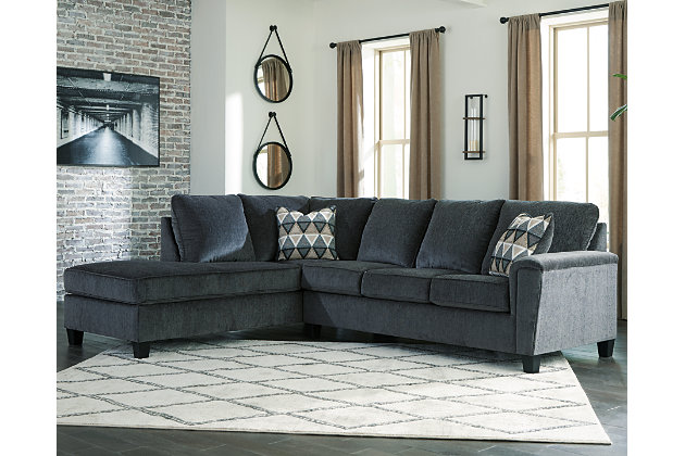 If you’re looking for a smokin' hot look priced to entice, you’re sure to find the budget-conscious Abinger sectional beautifully fits the bill. Covered in a smoke gray chenille upholstery loaded with plush texture, this less-is-more contemporary sectional is dressed to impress with angled side profiling and a track arm wrapped with a layer of pillowy softness for that little something extra. Open-ended chaise adds to this sectional’s swank look.Includes 2 pieces: left-arm facing corner chaise and right-arm facing sofa | “Left-arm” and "right-arm" describe the position of the arm when you face the piece | Corner-blocked frame | Attached back and loose seat cushions | High-resiliency foam cushions wrapped in thick poly fiber | Polyester upholstery | Throw pillows included | Pillows with soft polyfill | Exposed tapered feet | Platform foundation system resists sagging 3x better than spring system after 20,000 testing cycles by providing more even support | Smooth platform foundation maintains tight, wrinkle-free look without dips or sags that can occur over time with sinuous spring foundations | Estimated Assembly Time: 5 Minutes