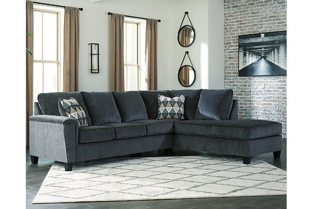 If you’re looking for a smokin' hot look priced to entice, you’re sure to find the budget-conscious Abinger sectional beautifully fits the bill. Covered in a smoke gray chenille upholstery loaded with plush texture, this less-is-more contemporary sectional is dressed to impress with angled side profiling and a track arm wrapped with a layer of pillowy softness for that little something extra. Open-ended chaise adds to this sectional’s swank look. Crafted of quality memory foam, a pull-out full mattress comfortably accommodates overnight guests.Includes 2 pieces: right-arm facing corner chaise and left-arm facing sofa sleeper  | "Left-arm" and "right-arm" describe the position of the arm when you face the piece | Corner-blocked frame | Attached back and loose seat cushions | High-resiliency foam cushions wrapped in thick poly fiber | Polyester upholstery | Throw pillows included | Pillows with soft polyfill | Exposed tapered feet | Included bi-fold full memory foam mattress sits atop a supportive steel frame | Memory foam provides better airflow for a cooler night’s sleep | Memory foam encased in damask ticking | Estimated Assembly Time: 5 Minutes