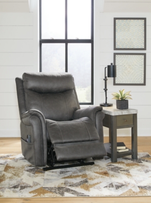 The Lorreze power lift recliner does the work for you, easing you to your feet from a relaxed sitting position or fully reclined. Irresistibly comfortable and ruggedly handsome, the neutral steel gray shade fits most any color scheme and room decor. This recliner has a heating element in the seat, plus a massage function to ensure total relaxation, so complete comfort is a foregone conclusion. With heavyweight padded faux leather for long-lasting durability, you'll be able to enjoy this recliner for quite a while.One-touch (hand control) power button with adjustable positions | Corner-blocked frame with metal reinforced seat | Attached cushions | High-resiliency foam cushions wrapped in thick poly fiber | Polyester upholstery | Motor allows custom comfort positioning | Heat element in seat; massage function | Heat and massage have auto shut-off after 30 minutes | Power cord included; UL Listed | Estimated Assembly Time: 15 Minutes