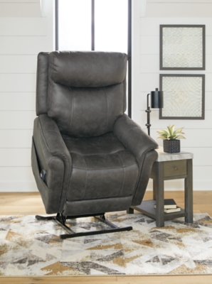 The Lorreze power lift recliner does the work for you, easing you to your feet from a relaxed sitting position or fully reclined. Irresistibly comfortable and ruggedly handsome, the neutral steel gray shade fits most any color scheme and room decor. This recliner has a heating element in the seat, plus a massage function to ensure total relaxation, so complete comfort is a foregone conclusion. With heavyweight padded faux leather for long-lasting durability, you'll be able to enjoy this recliner for quite a while.One-touch (hand control) power button with adjustable positions | Corner-blocked frame with metal reinforced seat | Attached cushions | High-resiliency foam cushions wrapped in thick poly fiber | Polyester upholstery | Motor allows custom comfort positioning | Heat element in seat; massage function | Heat and massage have auto shut-off after 30 minutes | Power cord included; UL Listed | Estimated Assembly Time: 15 Minutes