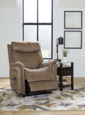 The Lorreze power lift recliner does the work for you, easing you to your feet from a relaxed sitting position or fully reclined. Irresistibly comfortable and ruggedly handsome, the neutral driftwood shade fits most any color scheme and room decor. This recliner has a heating element in the seat, plus a massage function to ensure total relaxation, so complete comfort is a foregone conclusion. With heavyweight padded faux leather for long-lasting durability, you'll be able to enjoy this recliner for quite a while.One-touch (hand control) power button with adjustable positions | Corner-blocked frame with metal reinforced seat | Attached cushions | High-resiliency foam cushions wrapped in thick poly fiber | Polyester upholstery | Heat element in seat; massage function | Heat and massage have auto shut-off after 30 minutes | Power cord included; UL Listed | Estimated Assembly Time: 15 Minutes