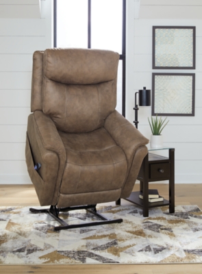 The Lorreze power lift recliner does the work for you, easing you to your feet from a relaxed sitting position or fully reclined. Irresistibly comfortable and ruggedly handsome, the neutral driftwood shade fits most any color scheme and room decor. This recliner has a heating element in the seat, plus a massage function to ensure total relaxation, so complete comfort is a foregone conclusion. With heavyweight padded faux leather for long-lasting durability, you'll be able to enjoy this recliner for quite a while.One-touch (hand control) power button with adjustable positions | Corner-blocked frame with metal reinforced seat | Attached cushions | High-resiliency foam cushions wrapped in thick poly fiber | Polyester upholstery | Heat element in seat; massage function | Heat and massage have auto shut-off after 30 minutes | Power cord included; UL Listed | Estimated Assembly Time: 15 Minutes