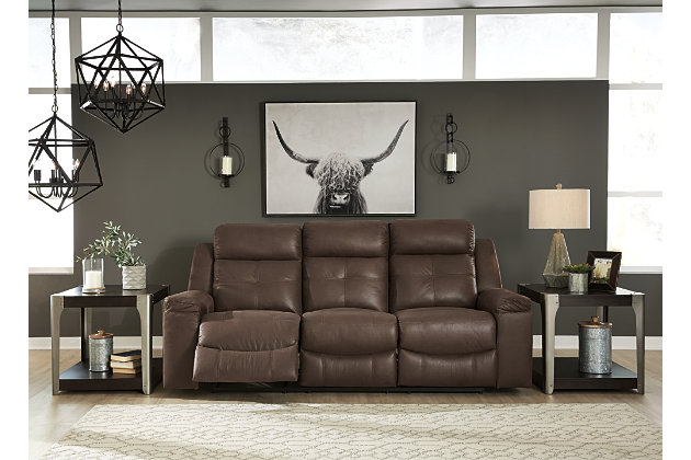 Rustic character comes forth in the warm brown Jesolo reclining sofa. Designer stitching adds a fashion-forward touch to the soft cushions. Faux suede fabric speaks to your knack for superior-quality materials. High back provides ample support as you get off your feet for a bit. With just one pull of tab, you’ll be easing back into relaxation. Infinite levels of comfort await.Corner-blocked frame with metal reinforced seat | Attached back and seat cushions | Pull tab reclining motion | Dual-sided recliner, middle seat remains stationary | High-resiliency foam cushions wrapped in thick poly fiber | Polyester/polyurethane upholstery | Estimated Assembly Time: 15 Minutes
