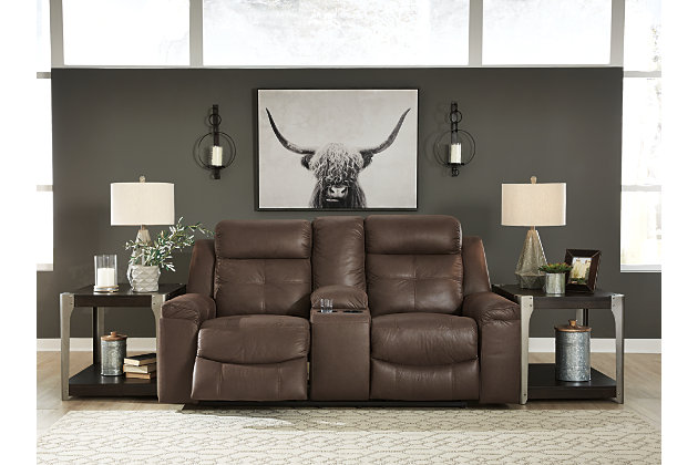 Rustic character comes forth in the warm brown Jesolo reclining loveseat. Designer stitching adds a fashion-forward touch to the soft cushions. Faux suede fabric speaks to your knack for superior-quality materials. High back provides ample support as you get off your feet for a bit. With just one pull of tab, you’ll be easing back into relaxation and popping your favorite beverage into a cup holder. Infinite levels of comfort await.Corner-blocked frame with metal reinforced seat | Attached back and seat cushions | Pull tab reclining motion | Lift-top storage console and 2 cup holders | High-resiliency foam cushions wrapped in thick poly fiber | Polyester/polyurethane upholstery | Estimated Assembly Time: 15 Minutes