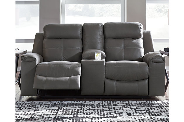 Rustic character comes forth in the dark gray Jesolo reclining loveseat with center console. Designer stitching adds a fashion-forward touch to the soft cushions. Faux suede fabric speaks to your knack for superior-quality materials. High back provides ample support as you get off your feet for a bit. With just one pull of tab, you’ll be easing back into relaxation and popping your favorite beverage into a cup holder. Infinite levels of comfort await.Corner-blocked frame with metal reinforced seat | Attached back and seat cushions | Pull tab reclining motion | Lift-top storage console and 2 cup holders | High-resiliency foam cushions wrapped in thick poly fiber | Polyester/polyurethane upholstery