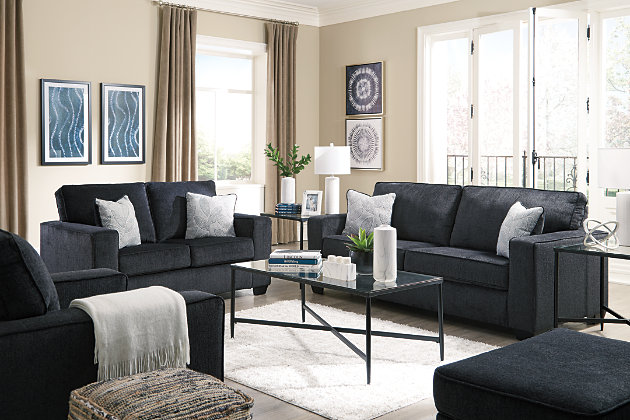 If style is the question, then the Altari living room set with sofa, loveseat, chair and ottoman is the answer. Sporting clean lines and sleek track arms, the decidedly contemporary profile is enhanced with plump cushioning and a chenille-feel upholstery, so pleasing to the touch. Sure to play well with so many color schemes, this living room set in slate gray includes understated floral pattern pillows for fashionably fresh appeal.Includes sofa, loveseat, chair and ottoman | Corner-blocked frame | Attached back and loose seat cushions | Firmly cushioned ottoman | High-resiliency foam cushions wrapped in thick poly fiber | Decorative pillows included | Pillows with soft polyfill | Polyester upholstery and pillows | Exposed feet with faux wood finish | Sofa, loveseat and chair's platform foundation system resists sagging 3x better than spring system after 20,000 testing cycles by providing more even support | Smooth platform foundation maintains tight, wrinkle-free look without dips or sags that can occur over time with sinuous spring foundations
