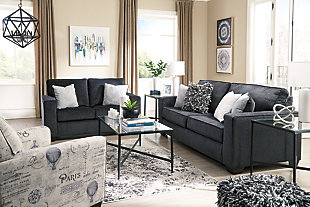 If style is the question, then the Altari sofa is the answer. Sporting clean lines and sleek track arms, the decidedly contemporary profile is enhanced with plump cushioning and a chenille-feel upholstery, so pleasing to the touch. Sure to play well with so many color schemes, this sofa in slate gray includes a pair of understated floral pattern pillows for fashionably fresh appeal.Corner-blocked frame | Attached back and loose seat cushions | High-resiliency foam cushions wrapped in thick poly fiber | 2 decorative pillows included | Pillows with soft polyfill | Polyester upholstery and pillows | Exposed feet with faux wood finish | Platform foundation system resists sagging 3x better than spring system after 20,000 testing cycles by providing more even support | Smooth platform foundation maintains tight, wrinkle-free look without dips or sags that can occur over time with sinuous spring foundations