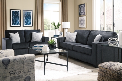 If style is the question, then the Altari loveseat is the answer. Sporting clean lines and sleek track arms, the decidedly contemporary profile is enhanced with plump cushioning and a chenille-feel upholstery, so pleasing to the touch. Sure to play well with so many color schemes, this loveseat in slate gray includes a pair of understated floral pattern pillows for fashionably fresh appeal.Corner-blocked frame | Attached back and loose seat cushions | High-resiliency foam cushions wrapped in thick poly fiber | 2 decorative pillows included | Pillows with soft polyfill | Polyester upholstery and pillows | Exposed feet with faux wood finish | Platform foundation system resists sagging 3x better than spring system after 20,000 testing cycles by providing more even support | Smooth platform foundation maintains tight, wrinkle-free look without dips or sags that can occur over time with sinuous spring foundations