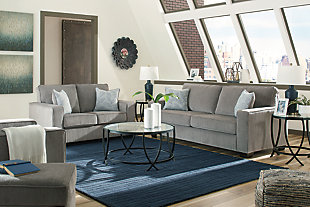 If style is the question, then the Altari living room set with sofa, loveseat, chair and ottoman is the answer. Sporting clean lines and sleek track arms, the decidedly contemporary profile is enhanced with plump cushioning and a chenille-feel upholstery, so pleasing to the touch. Sure to play well with so many color schemes, this living room set in richly neutral alloy includes understated floral pattern pillows for fashionably fresh appeal.Includes sofa, loveseat, chair and ottoman | Corner-blocked frame | Attached back and loose seat cushions | Firmly cushioned ottoman | High-resiliency foam cushions wrapped in thick poly fiber | Decorative pillows included | Pillows with soft polyfill | Polyester upholstery and pillows | Exposed feet with faux wood finish | Sofa, loveseat and chair's platform foundation system resists sagging 3x better than spring system after 20,000 testing cycles by providing more even support | Smooth platform foundation maintains tight, wrinkle-free look without dips or sags that can occur over time with sinuous spring foundations