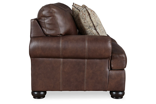 What could be better than the feel of real leather? It’s yours for the taking—at a comfortably affordable price—with the Beamerton sofa sleeper. Rest assured, the seating area and armrests are covered in genuine leather for an incomparable experience. Plush roll arms and distinctive details such as box-stitched cushions and prominent bun feet reflect a sense of richly rustic charm that never goes out of style. Memory foam queen mattress comfortably accommodates overnight guests.Corner-blocked frame | Attached back and loose seat cushions | High-resiliency foam cushions wrapped in thick poly fiber | Leather interior upholstery; vinyl/polyester exterior upholstery | 2 throw pillows included | Pillows with soft polyfill | Exposed feet with faux wood finish | Included bi-fold queen memory foam mattress sits atop a supportive steel frame | Memory foam provides better airflow for a cooler night’s sleep | Memory foam encased in damask ticking