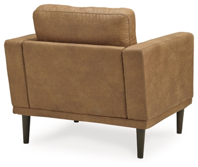 For a fresh spot in your space, turn to the Arroyo arm chair. This invigorating piece breathes warmth into your home with its striking caramel faux leather upholstery and tapered legs. Wind down at the end of a long day when you sink into this canyon of comfort.Corner-blocked frame | High-resiliency foam cushions wrapped in thick poly fiber | Non-reversible loose seat and back cushions | Metal seat base | Polyester and polyurethane (faux leather) upholstery | Exposed legs with faux wood finish | Minor assembly (simply attach legs) | Estimated Assembly Time: 15 Minutes