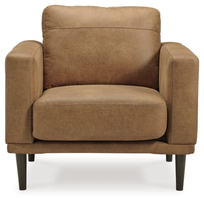 For a fresh spot in your space, turn to the Arroyo arm chair. This invigorating piece breathes warmth into your home with its striking caramel faux leather upholstery and tapered legs. Wind down at the end of a long day when you sink into this canyon of comfort.Corner-blocked frame | High-resiliency foam cushions wrapped in thick poly fiber | Non-reversible loose seat and back cushions | Metal seat base | Polyester and polyurethane (faux leather) upholstery | Exposed legs with faux wood finish | Minor assembly (simply attach legs) | Estimated Assembly Time: 15 Minutes