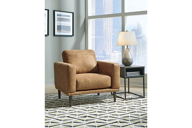 For a fresh spot in your space, turn to the Arroyo arm chair. This invigorating piece breathes warmth into your home with its striking caramel faux leather upholstery and tapered legs. Wind down at the end of a long day when you sink into this canyon of comfort.Corner-blocked frame | High-resiliency foam cushions wrapped in thick poly fiber | Non-reversible loose seat and back cushions | Metal seat base | Polyester and polyurethane (faux leather) upholstery | Exposed legs with faux wood finish | Minor assembly (simply attach legs) | Estimated Assembly Time: 15 Minutes