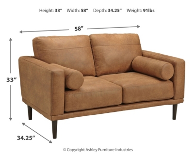 For a fresh spot in your space, turn to the Arroyo loveseat. This invigorating piece breathes warmth into your home with its striking caramel faux leather upholstery, modern bolster pillows and tapered legs. Wind down at the end of a long day when you sink into this canyon of comfort.Corner-blocked frame | High-resiliency foam cushions wrapped in thick poly fiber | Non-reversible loose seat and back cushions | Metal seat base | Polyester and polyurethane (faux leather) upholstery | 2 bolster pillows | Exposed legs with faux wood finish | Minor assembly (simply attach legs) | Estimated Assembly Time: 15 Minutes