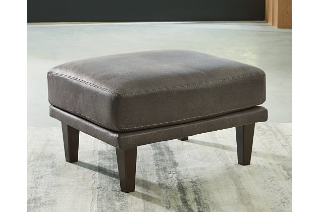 For a fresh spot in your space, turn to the Arroyo designer ottoman. This invigorating ottoman breathes warmth into your home with its striking gray faux leather upholstery and tapered legs. Wind down at the end of a long day with your feet propped up on this canyon of comfort.Corner-blocked frame | Firmly cushioned | High-resiliency foam cushion wrapped in thick poly fiber | Metal base | Polyester/polyurethane upholstery | Exposed legs with faux wood finish | Minor assembly (simply attach legs) | Estimated Assembly Time: 15 Minutes