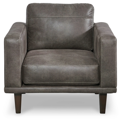 For a fresh spot in your space, turn to the Arroyo designer arm chair. This invigorating piece breathes warmth into your home with its striking gray faux leather upholstery and tapered legs. Wind down at the end of a long day when you sink into this canyon of comfort.Corner-blocked frame | High-resiliency foam cushions wrapped in thick poly fiber | Non-reversible loose seat and back cushions | Metal seat base | Polyester/polyurethane upholstery | Exposed legs with faux wood finish | Minor assembly (simply attach legs) | Estimated Assembly Time: 15 Minutes