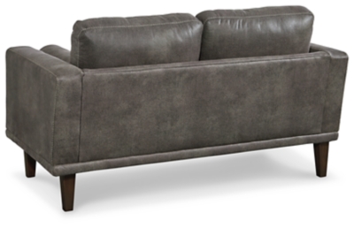 For a fresh spot in your space, turn to the Arroyo designer loveseat. This invigorating piece breathes warmth into your home with its striking gray faux leather upholstery and tapered legs. Wind down at the end of a long day when you sink into this canyon of comfort.Corner-blocked frame | High-resiliency foam cushions wrapped in thick poly fiber | Non-reversible loose seat and back cushions | Metal seat base | Polyester/polyurethane upholstery | 2 bolster pillows | Exposed legs with faux wood finish | Minor assembly (simply attach legs) | Estimated Assembly Time: 15 Minutes