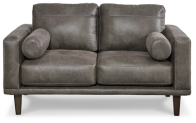 For a fresh spot in your space, turn to the Arroyo designer loveseat. This invigorating piece breathes warmth into your home with its striking gray faux leather upholstery and tapered legs. Wind down at the end of a long day when you sink into this canyon of comfort.Corner-blocked frame | High-resiliency foam cushions wrapped in thick poly fiber | Non-reversible loose seat and back cushions | Metal seat base | Polyester/polyurethane upholstery | 2 bolster pillows | Exposed legs with faux wood finish | Minor assembly (simply attach legs) | Estimated Assembly Time: 15 Minutes