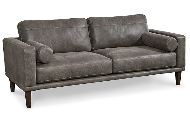 For a fresh spot in your space, turn to the Arroyo designer sofa. This invigorating piece breathes warmth into your home with its striking gray faux leather upholstery, modern bolster pillows and tapered legs. Wind down at the end of a long day when you sink into this canyon of comfort.Corner-blocked frame | High-resiliency foam cushions wrapped in thick poly fiber | Non-reversible loose seat and back cushions | Metal seat base | Polyester/polyurethane upholstery | 2 bolster pillows | Exposed legs with faux wood finish | Minor assembly (simply attach legs) | Estimated Assembly Time: 15 Minutes