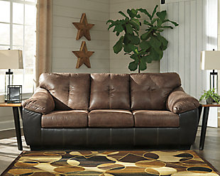 The Gregale sofa flawlessly blends handsome rugged looks with soft, inviting comfort. The result? A sporty design that looks just as good in a polished space as it does a bachelor pad. Classic black has never looked better than with brown subtly aged faux leather. Decorative jumbo stitching brings together the two-tone design with a touch of refinement.Corner-blocked frame | Attached back and loose seat cushions | High-resiliency foam cushions wrapped in thick poly fiber | Platform foundation system resists sagging 3x better than spring system after 20,000 testing cycles by providing more even support | Smooth platform foundation maintains tight, wrinkle-free look without dips or sags that can occur over time with sinuous spring foundations | Polyester/polyurethane interior; PVC/polyester/polyurethane exterior upholstery | Exposed feet with faux wood finish
