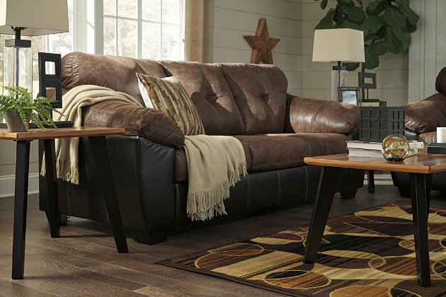The Gregale sofa flawlessly blends handsome rugged looks with soft, inviting comfort. The result? A sporty design that looks just as good in a polished space as it does a bachelor pad. Classic black has never looked better than with brown subtly aged faux leather. Decorative jumbo stitching brings together the two-tone design with a touch of refinement.Corner-blocked frame | Attached back and loose seat cushions | High-resiliency foam cushions wrapped in thick poly fiber | Platform foundation system resists sagging 3x better than spring system after 20,000 testing cycles by providing more even support | Smooth platform foundation maintains tight, wrinkle-free look without dips or sags that can occur over time with sinuous spring foundations | Polyester/polyurethane interior; PVC/polyester/polyurethane exterior upholstery | Exposed feet with faux wood finish