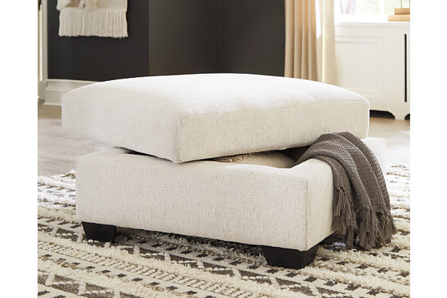 Let it snow. Doubling your pleasure with its combination of form and function, the Cambri storage ottoman in a snow-tone chenille fabric invites you to stretch your style in an easy-elegant way. Whether your aesthetic is urban hip or suburban chic, this posh ottoman with removable cushioned top and loads of handy storage is sure to look and feel right at home. And how’s this for a welcome surprise: a built-in tabletop with cup holders on the flip side!Corner-blocked frame | High-resiliency foam cushion wrapped in thick poly fiber | Polyester upholstery | Storage under cushioned removable top | Built-in tabletop/cup holders on reverse side of removable cushion | Exposed legs with faux wood finish