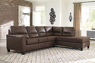 If you love the cool look of leather but long for the warm feel of fabric, you can take comfort in the McCammon sectional. Wrapped in a fabulous faux leather with a weathered hue and hint of pebbly texture to resemble the real deal, this decidedly modern sectional proves less is more. Elements include angled side profiling and track armrests wrapped with a layer of pillowy softness for that little something extra. Prominent jumbo stitching and clean-lined divided back styling lend fashion-forward flair.Includes 2 pieces: right-arm facing corner chaise and left-arm facing sofa | "Left-arm" and "right-arm" describe the position of the arm when you face the piece | Corner-blocked frame | High-resiliency foam cushions wrapped in thick poly fiber | Polyester and polyurethane (faux leather) upholstery  | Attached back and loose seat cushions | Exposed feet with faux wood finish | Platform foundation system resists sagging 3x better than spring system after 20,000 testing cycles by providing more even support | Smooth platform foundation maintains tight, wrinkle-free look without dips or sags that can occur over time with sinuous spring foundations | Estimated Assembly Time: 5 Minutes